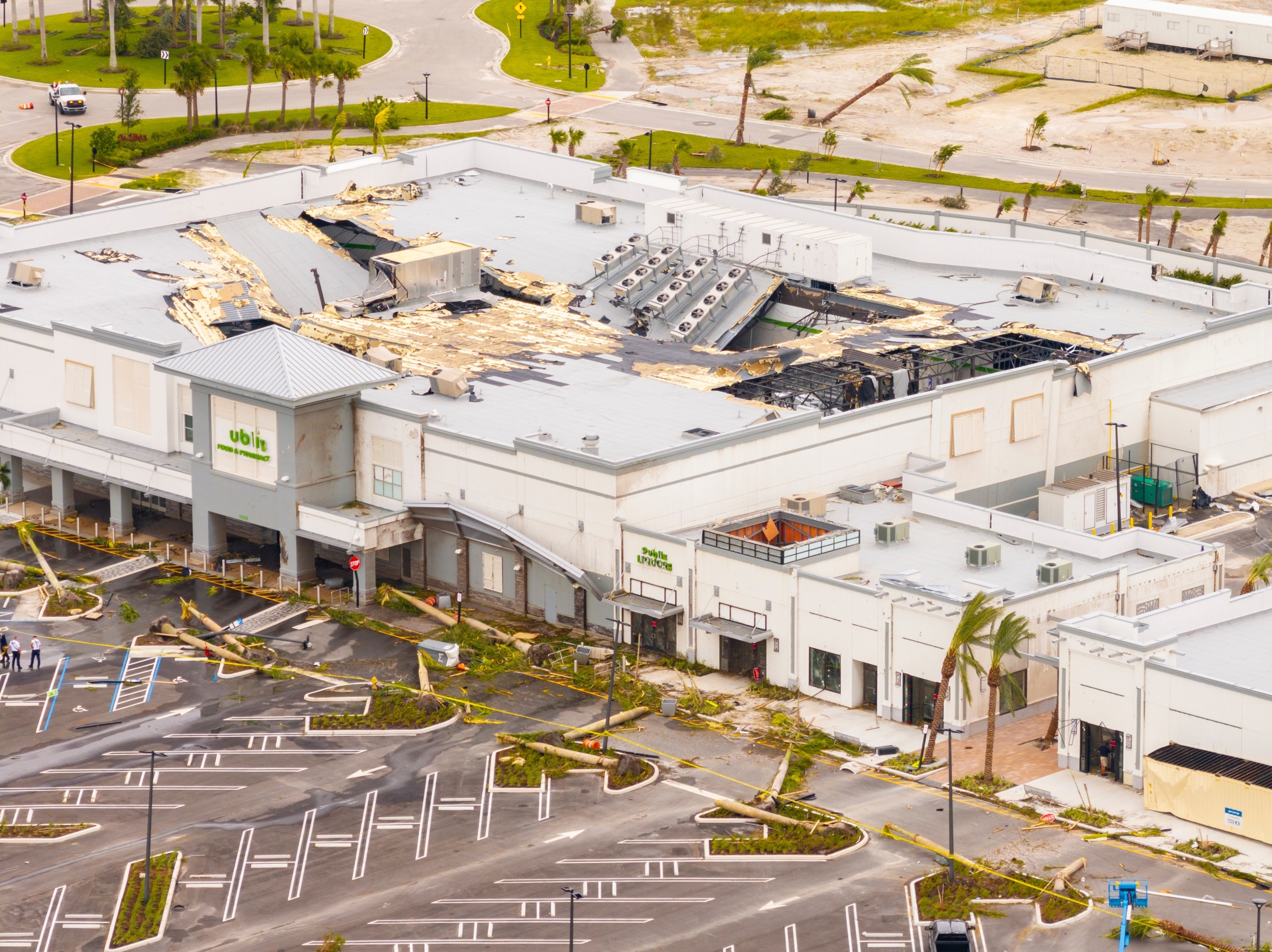 Storm-damaged commercial roof and property after a catastrophe event