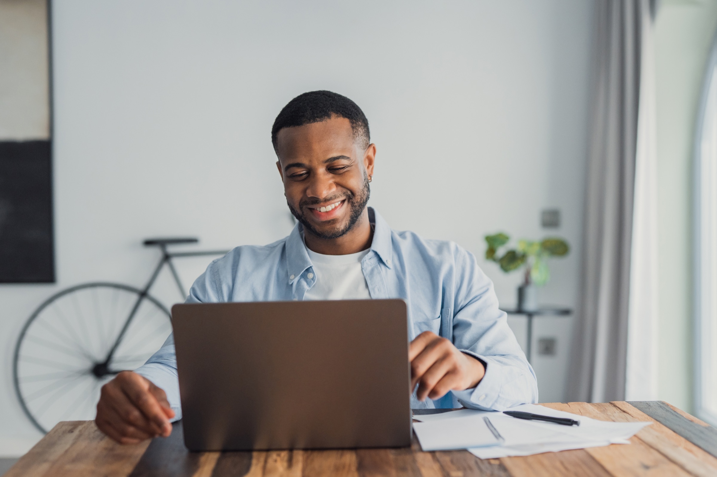 Claims professional reviewing documents at a computer