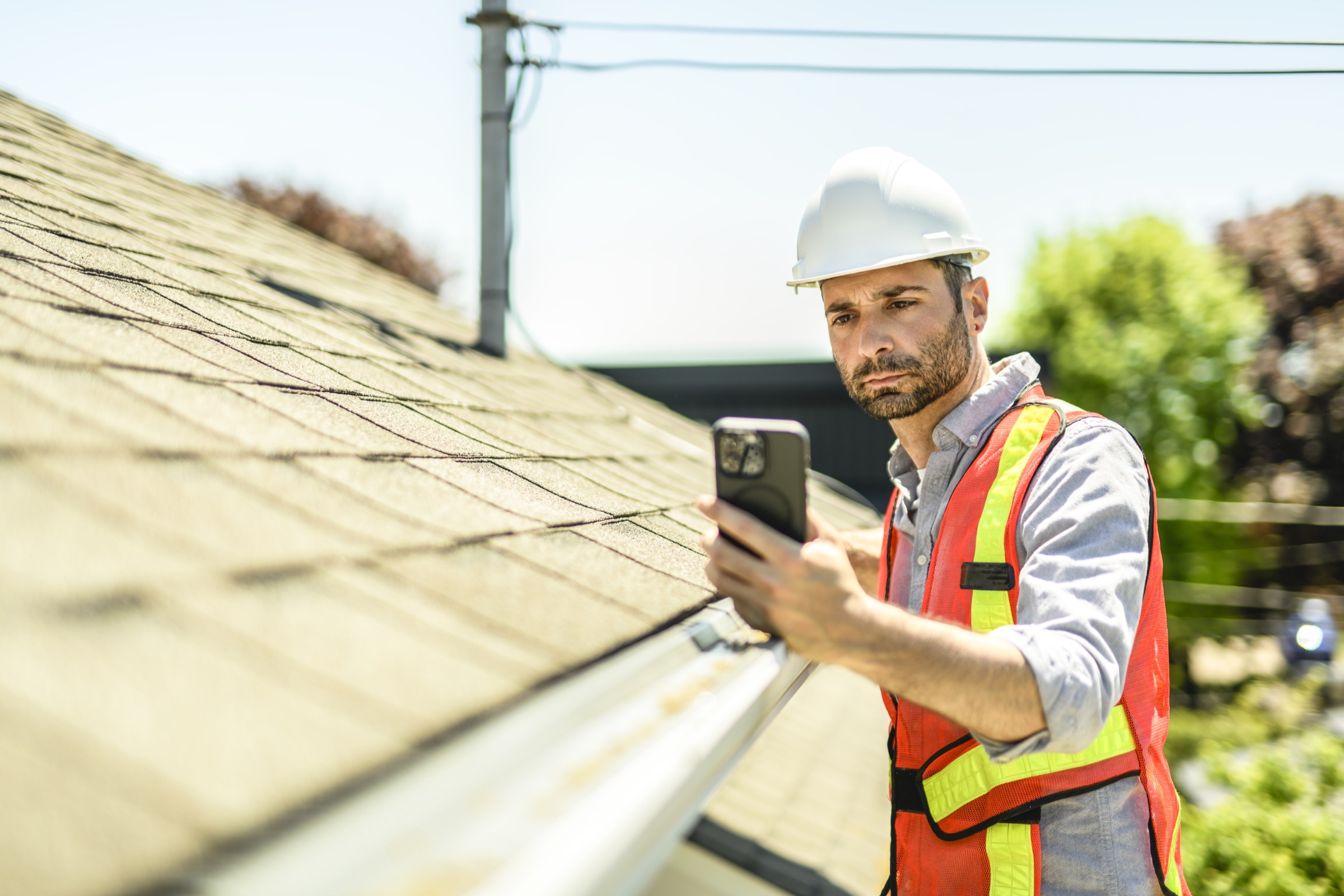 Adjuster documenting damage during a field inspection